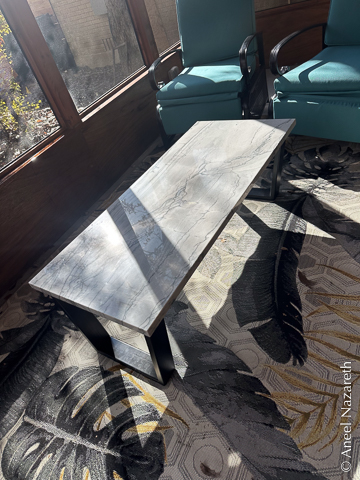 A long, low table with thick tubing (3" x 1")